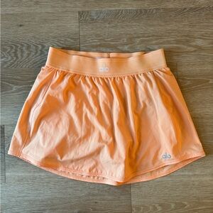 ALO MATCHPOINT SKORT - CANTALOUPE SMALL